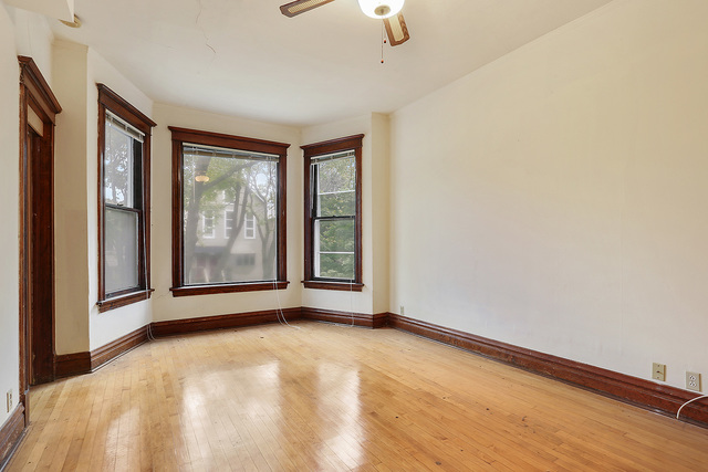 1745 West School Street Chicago, IL 60657 - Photo 6 of 12 a view of an empty room with glass door