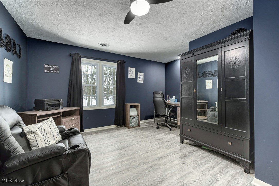 5927 Highland Road Highland Heights, OH 44143 - Photo 22 of 22 Office area featuring ceiling fan, light hardwood / wood-style floors, and a textured ceiling