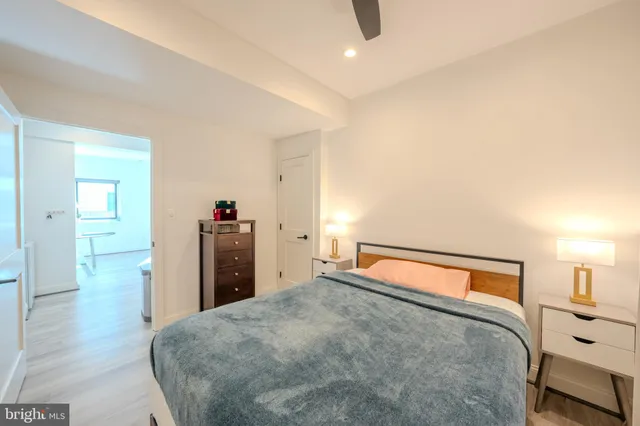 a bedroom with a bed and a lamp