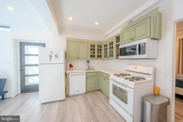 a kitchen with a stove and a microwave