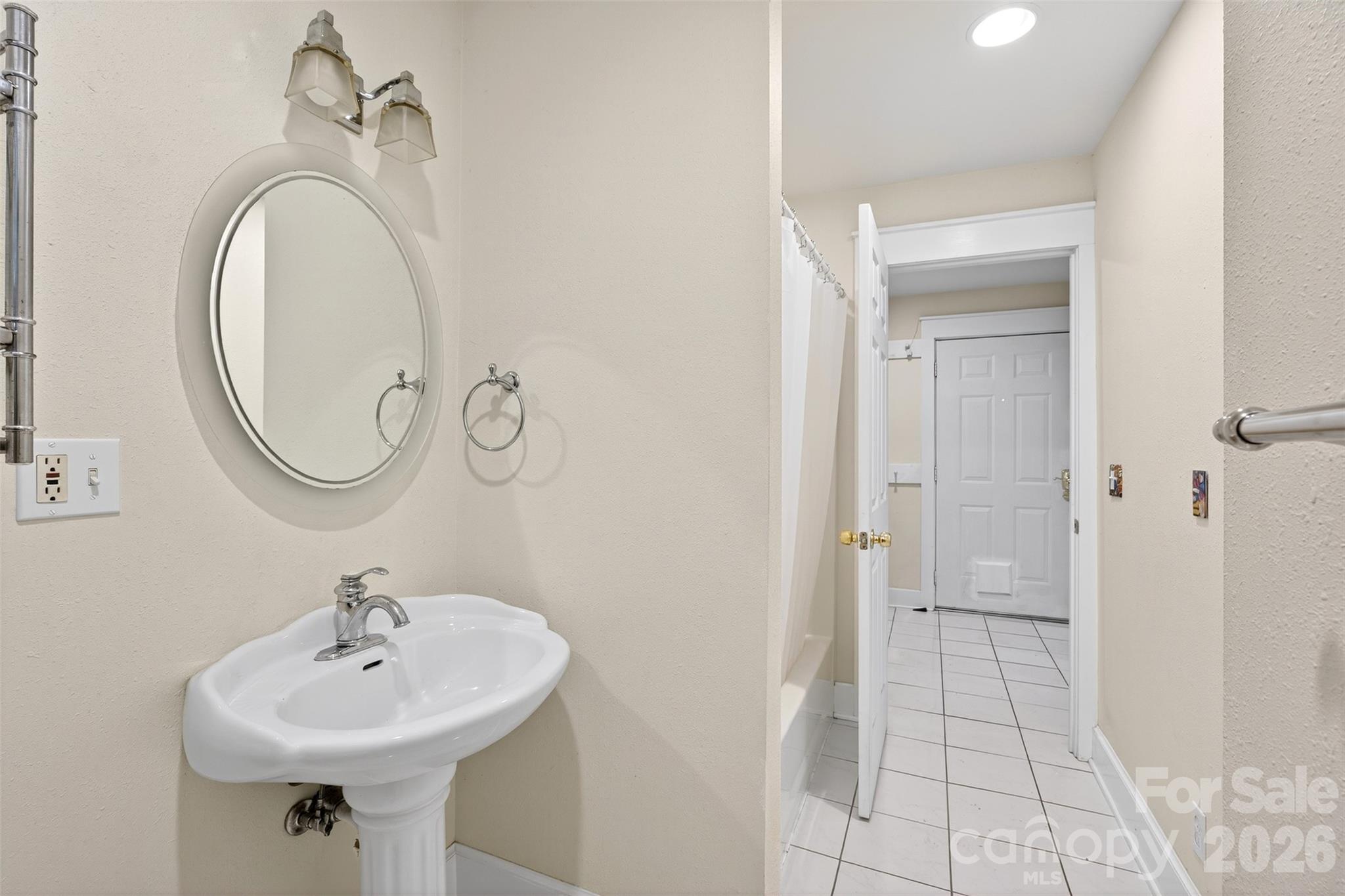 160 East Howard Street Tryon, NC 28782 - Photo 26 of 48 a bathroom with a sink a toilet and a mirror
