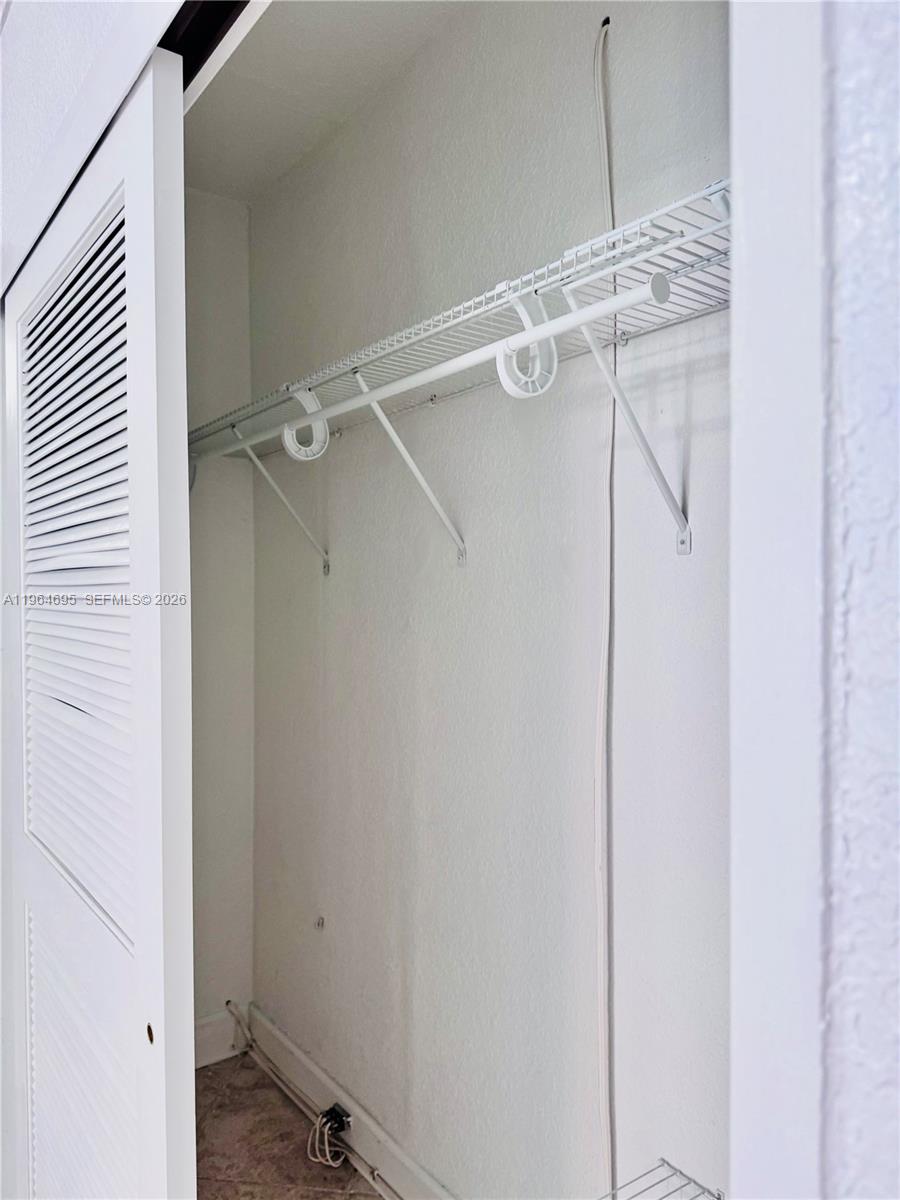 401 69th Street, Unit 607 Miami Beach, FL 33141 - Photo 31 of 89 a bathroom with a shower