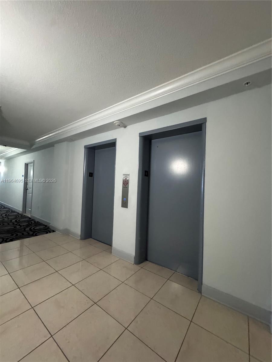 401 69th Street, Unit 607 Miami Beach, FL 33141 - Photo 44 of 89 a view of an empty room and window