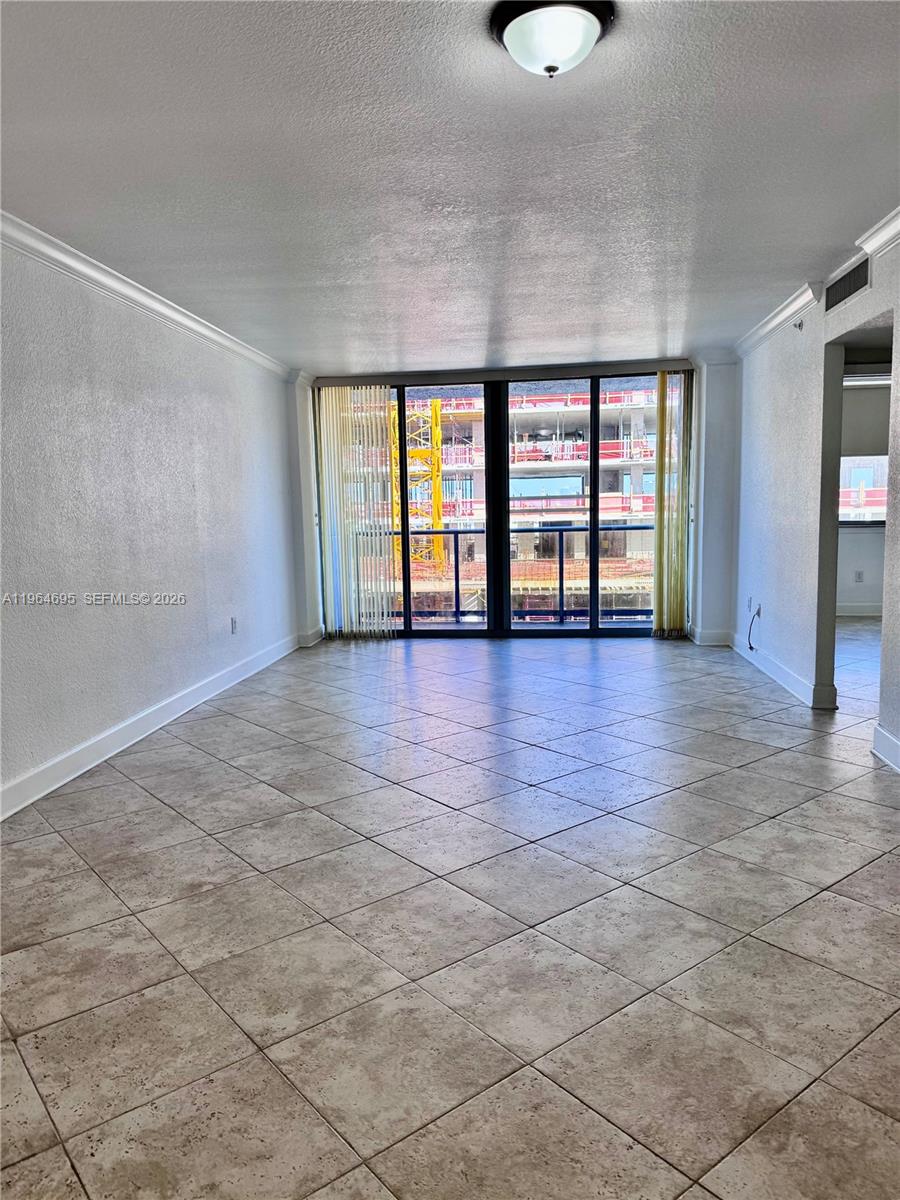 401 69th Street, Unit 607 Miami Beach, FL 33141 - Photo 51 of 89 a view of an empty room with a window