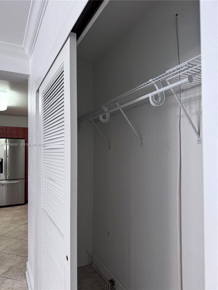 401 69th Street, Unit 607 Miami Beach, FL 33141 - Photo 52 of 89 a view of a room with racks on the wall