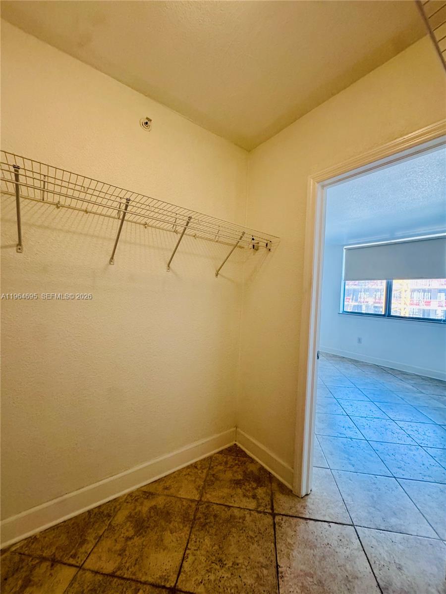 401 69th Street, Unit 607 Miami Beach, FL 33141 - Photo 64 of 89 a view of a room with rack on the wall