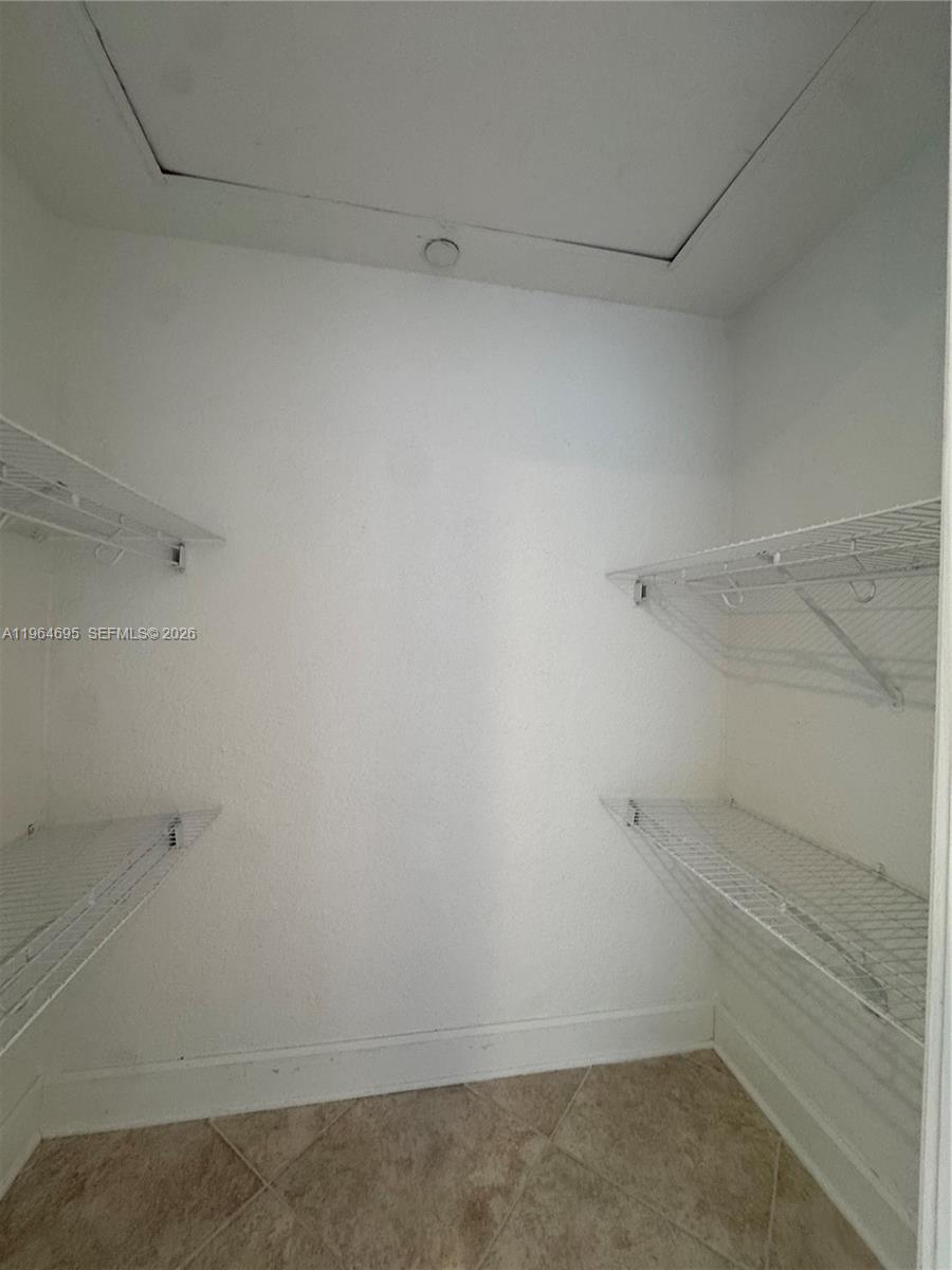 401 69th Street, Unit 607 Miami Beach, FL 33141 - Photo 66 of 89 a view of an empty walk in closet