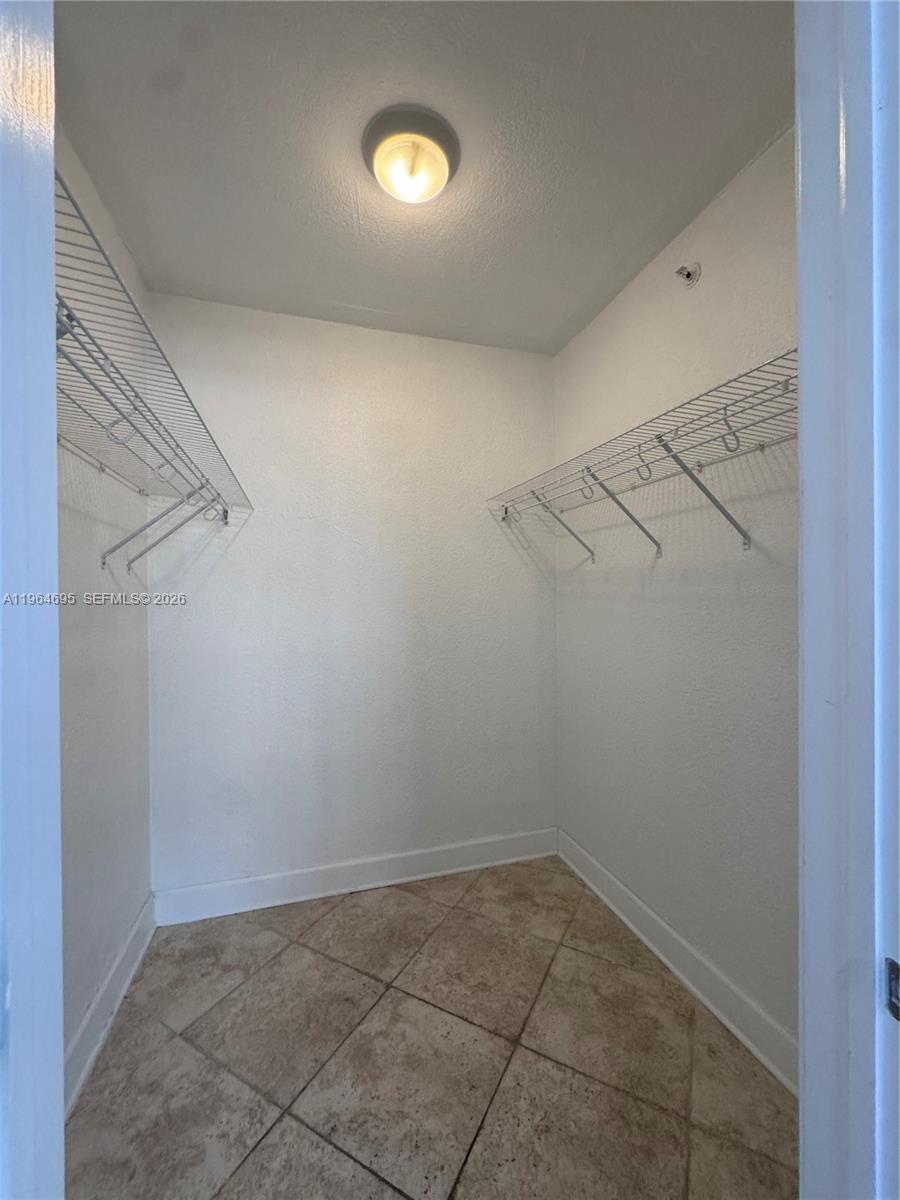 401 69th Street, Unit 607 Miami Beach, FL 33141 - Photo 67 of 89 a view of a room with racks on the wall