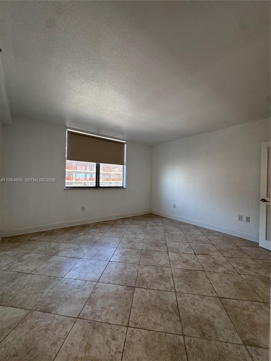 401 69th Street, Unit 607 Miami Beach, FL 33141 - Photo 70 of 89 a view of an empty room and a window