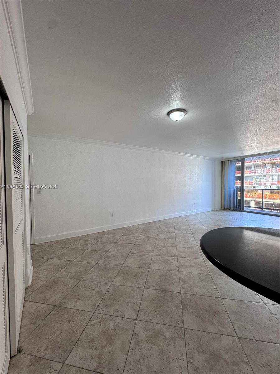 401 69th Street, Unit 607 Miami Beach, FL 33141 - Photo 71 of 89 a view of kitchen and empty room with windows