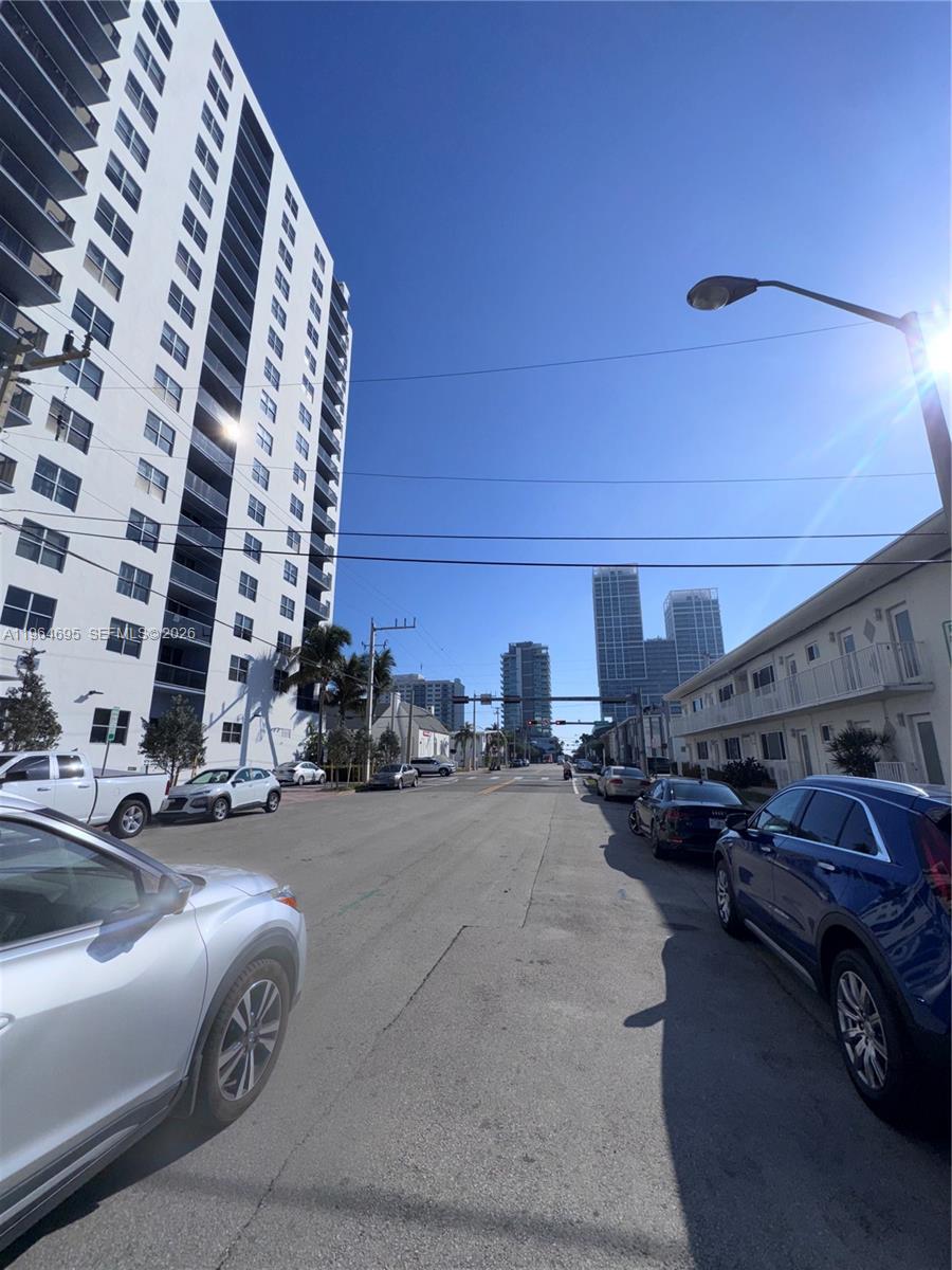 401 69th Street, Unit 607 Miami Beach, FL 33141 - Photo 85 of 89 a view of parking with cars parked