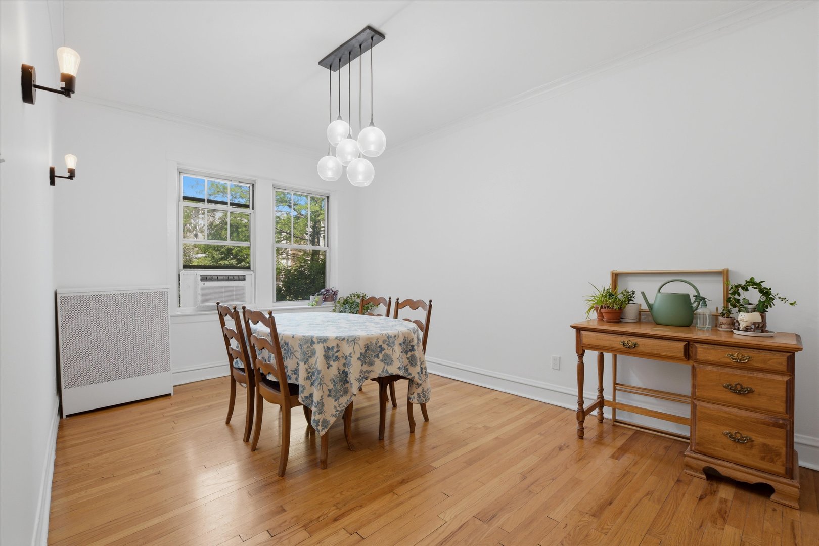 240 South Maple Avenue, Unit 1W Oak Park, IL 60302 - Photo 4 of 11 a view of a dining room with furniture wooden floor and chandelier
