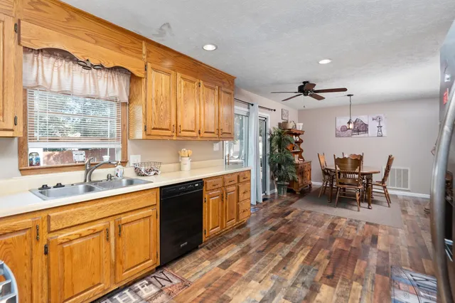 a kitchen with sink cabinets and window