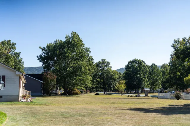 a view of a house with a big yard