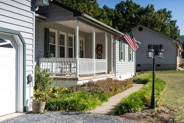 a front view of a house with garden