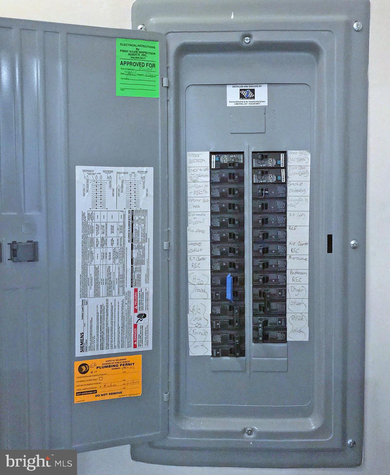 17476 Slipper Shell Way, Unit 10 Lewes, DE 19958 - Photo 14 of 29 Electric Panel with July 2007 Inspection Stickers