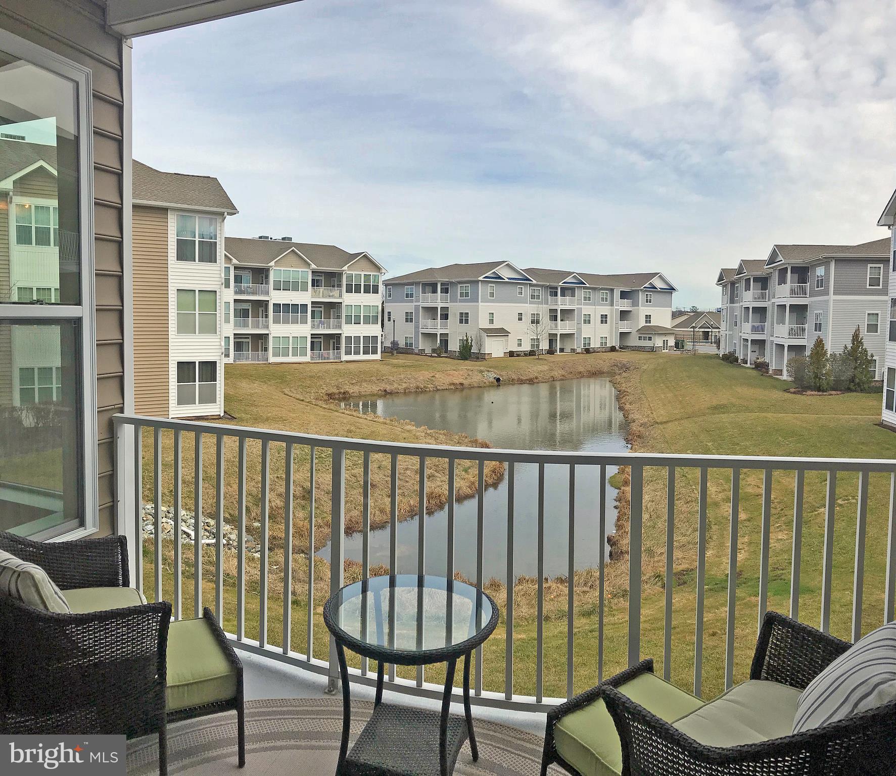 17476 Slipper Shell Way, Unit 10 Lewes, DE 19958 - Photo 16 of 29 Master Bedroom Balcony with Pond Views