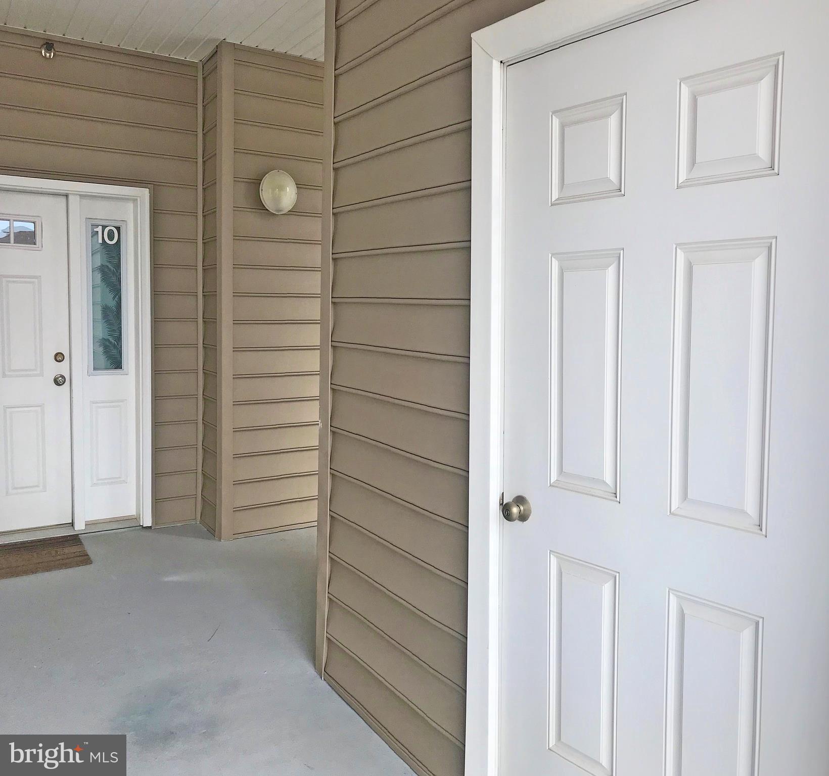 17476 Slipper Shell Way, Unit 10 Lewes, DE 19958 - Photo 25 of 29 Storage Closet Adjacent to Front Door