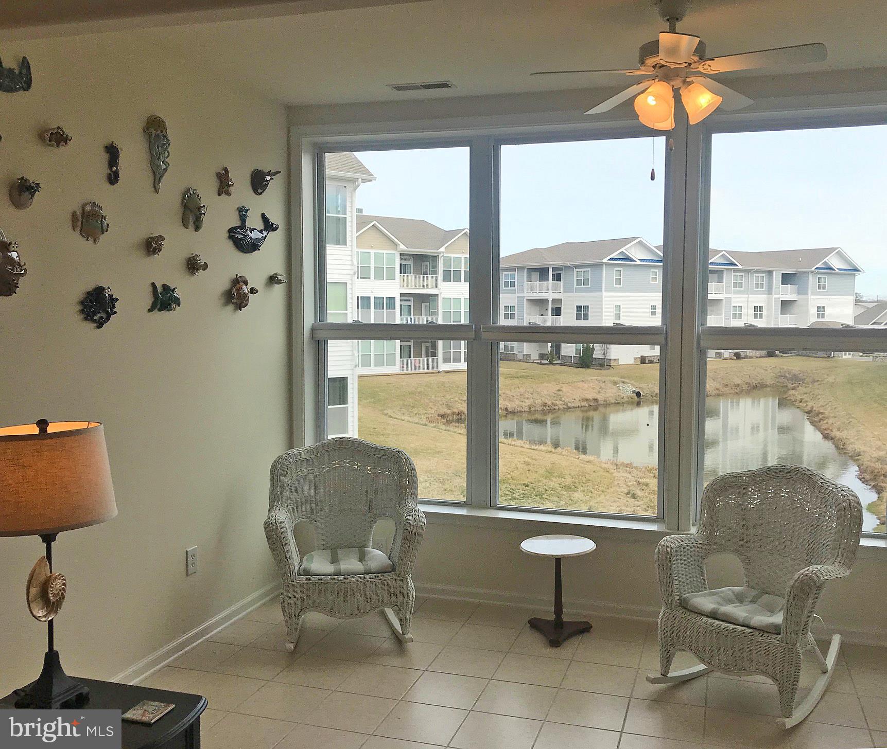 17476 Slipper Shell Way, Unit 10 Lewes, DE 19958 - Photo 5 of 29 Sunroom with Pond Views