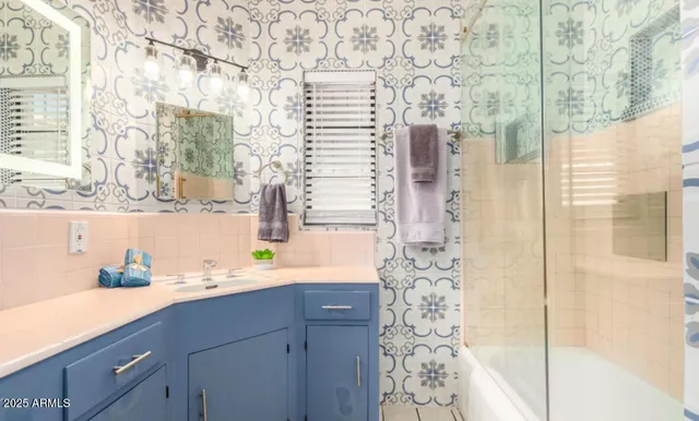 a bathroom with a sink and a mirror