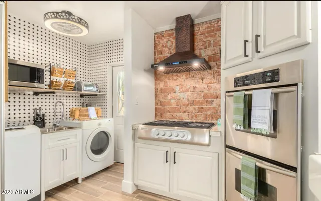 a utility room with dryer and washer