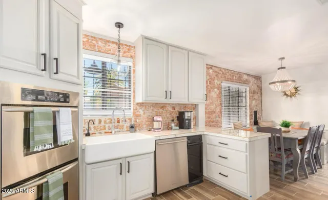a kitchen with sink cabinets and window