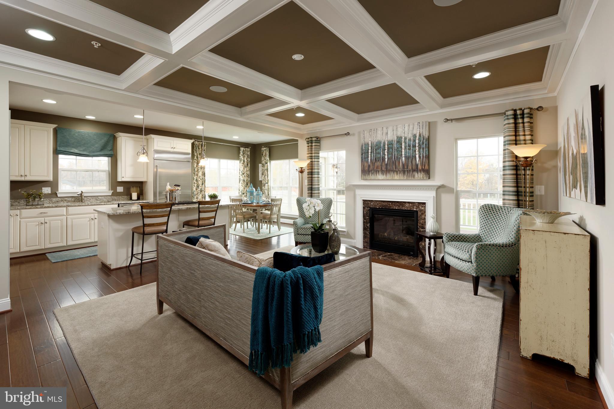 a living room with furniture a fireplace and a table