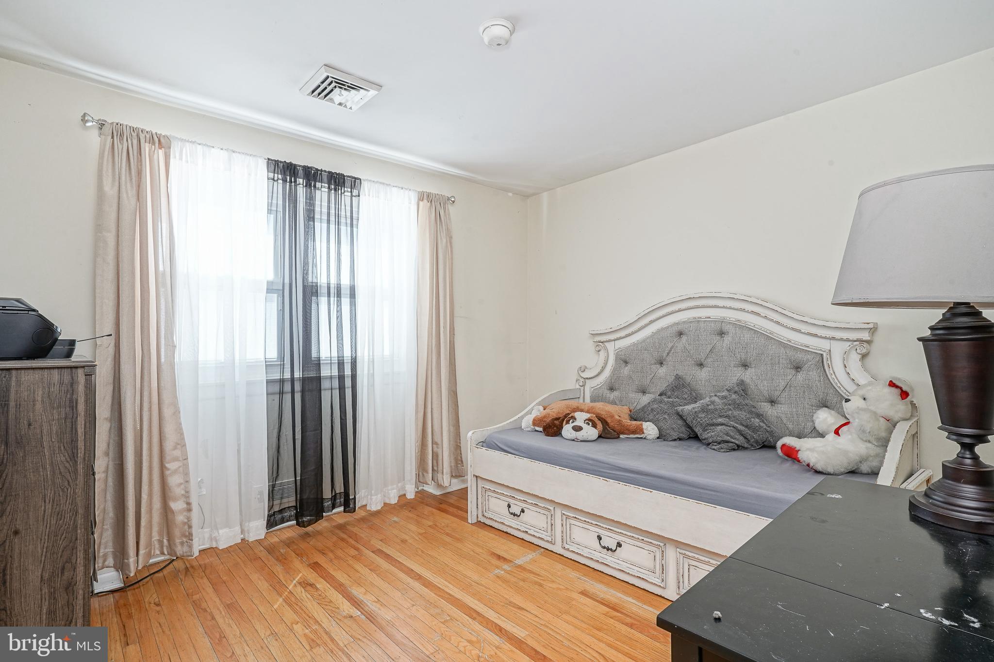 32 Strathmore Drive Cherry Hill, NJ 08003 - Photo 13 of 33 a bedroom with a bed and wooden floor