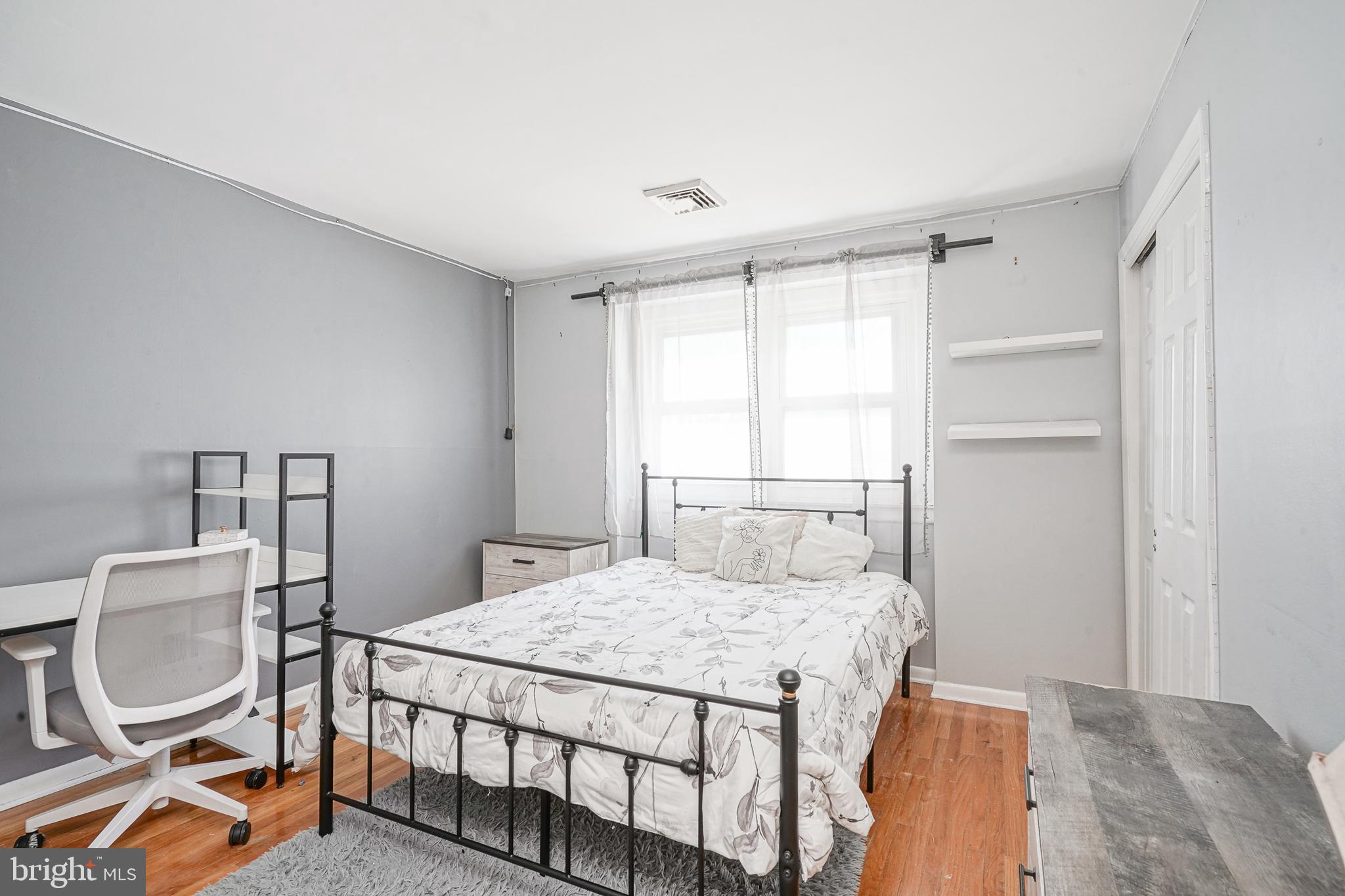 32 Strathmore Drive Cherry Hill, NJ 08003 - Photo 14 of 33 a bedroom with a bed a chair and a window