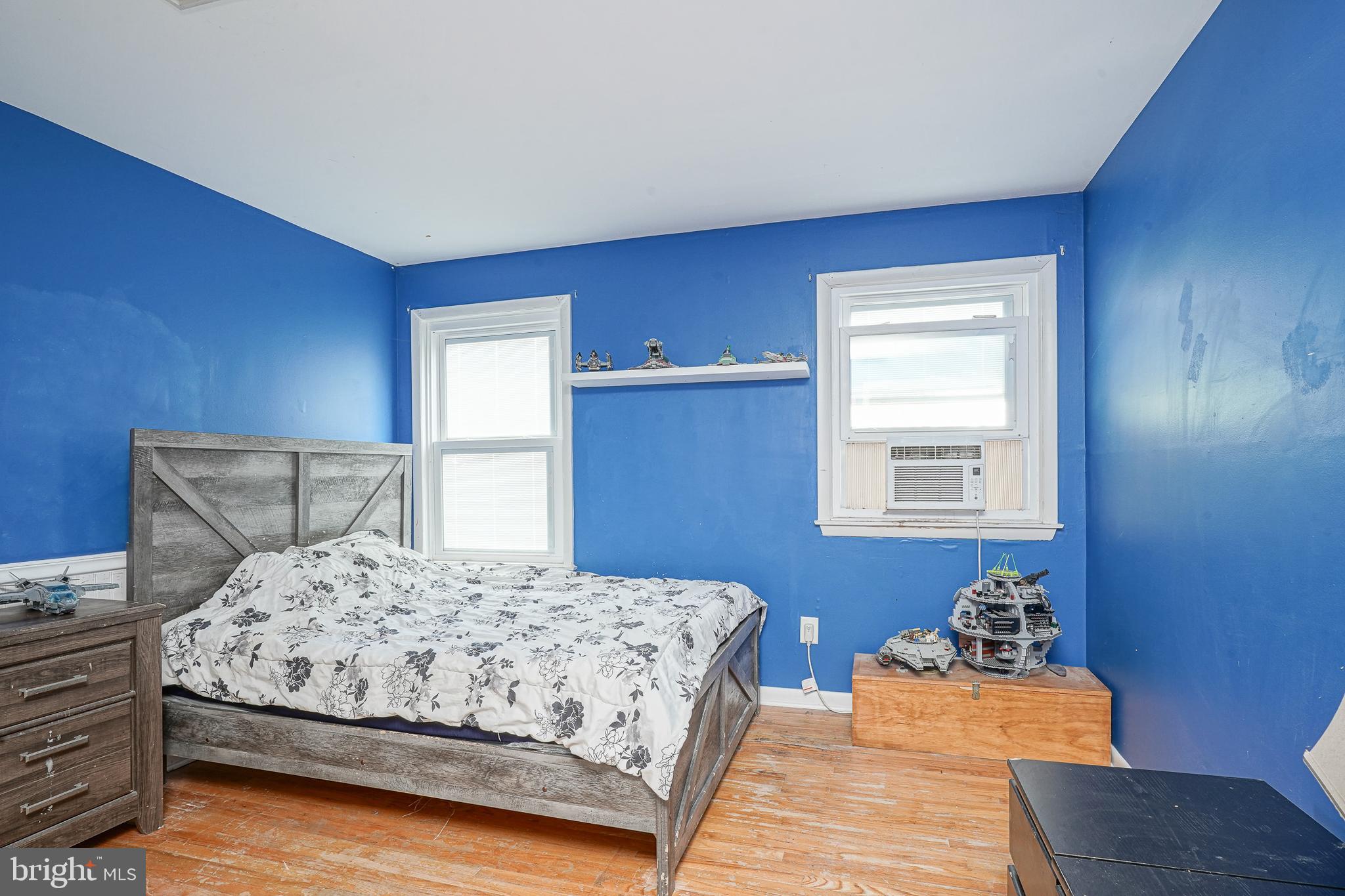 32 Strathmore Drive Cherry Hill, NJ 08003 - Photo 15 of 33 a bedroom with a bed and a lamp with wooden floor
