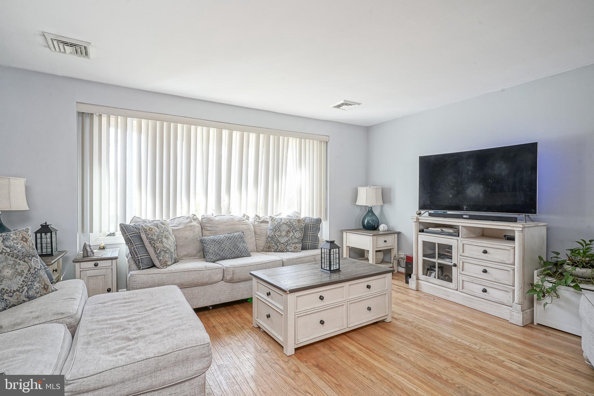 32 Strathmore Drive Cherry Hill, NJ 08003 - Photo 4 of 33 a living room with furniture and a flat screen tv