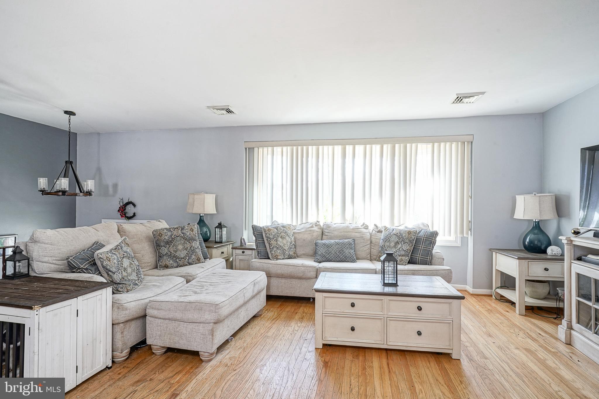32 Strathmore Drive Cherry Hill, NJ 08003 - Photo 5 of 33 a living room with furniture and a large window