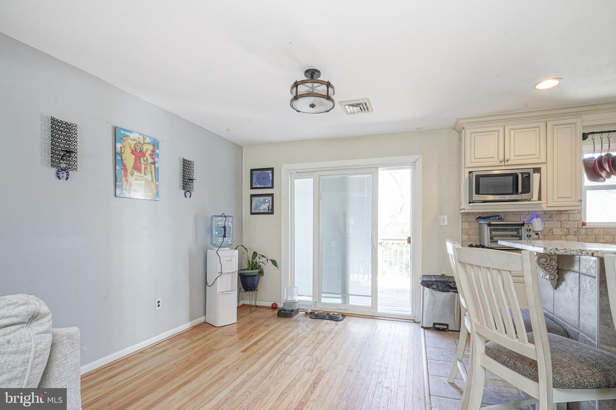 32 Strathmore Drive Cherry Hill, NJ 08003 - Photo 6 of 33 a view of a kitchen with fridge and wooden floor
