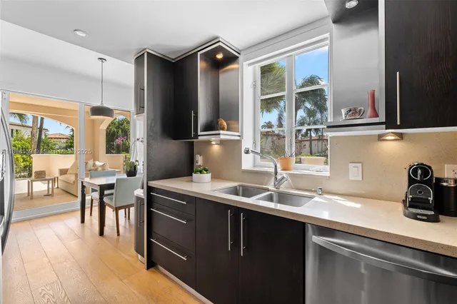a kitchen with a sink and a refrigerator