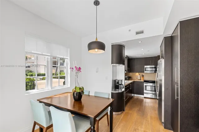 a dining room with furniture and window
