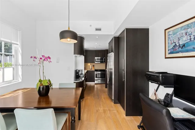 a view of a dining room with furniture window and outside view