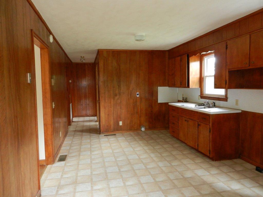 630 Power Dam Road Rocky Mount, VA 24151 - Photo 3 of 12 a kitchen with stainless steel appliances granite countertop a refrigerator and a sink