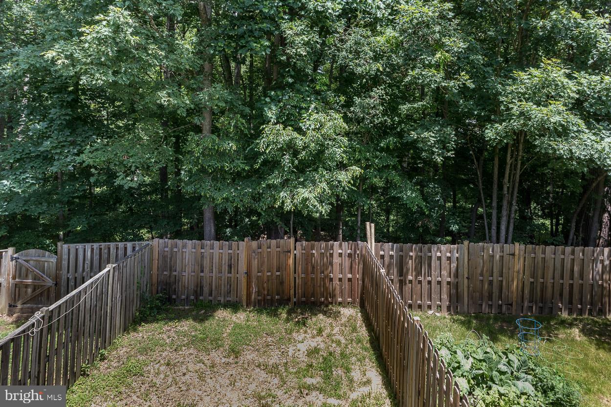 3504 Corn Stream Road Randallstown, MD 21133 - Photo 34 of 34 a garden view with wooden fence
