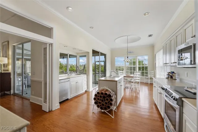 a large white kitchen with lots of counter top space