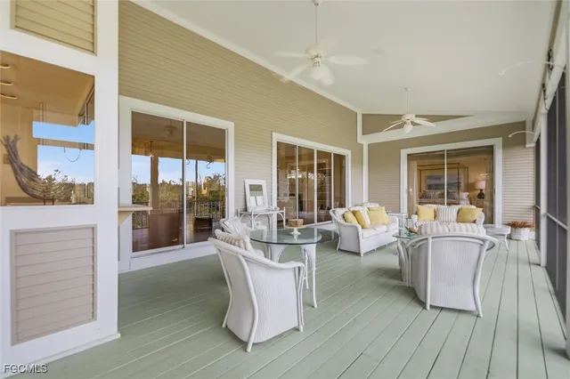 a living room with fireplace furniture and a wooden floor