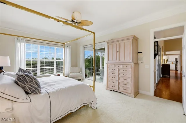 a spacious bedroom with a bed and a large window