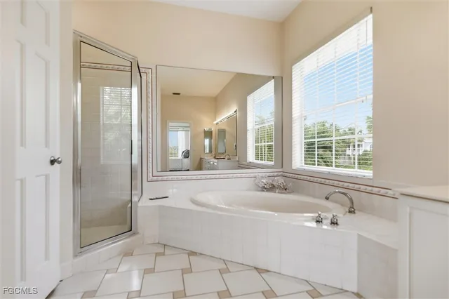 a spacious bathroom with sink and shower