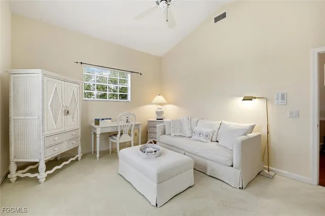 a living room with furniture and windows