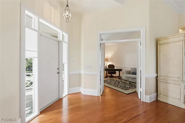 a view of a livingroom kitchen and workspace