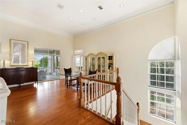 a view of a livingroom with furniture window and wooden floor