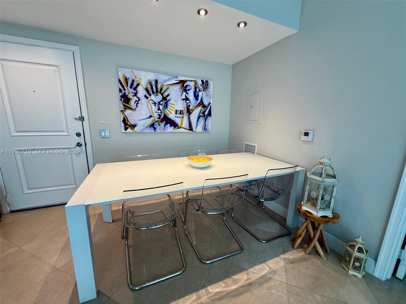 480 Northeast 30th Street, Unit 1505 Miami, FL 33137 - Photo 4 of 21 a room with a table and couch