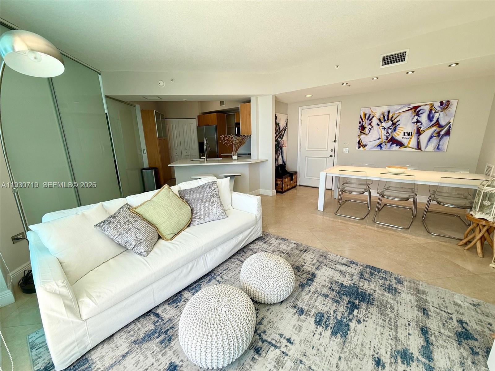 480 Northeast 30th Street, Unit 1505 Miami, FL 33137 - Photo 6 of 21 a living room with furniture and wooden floor