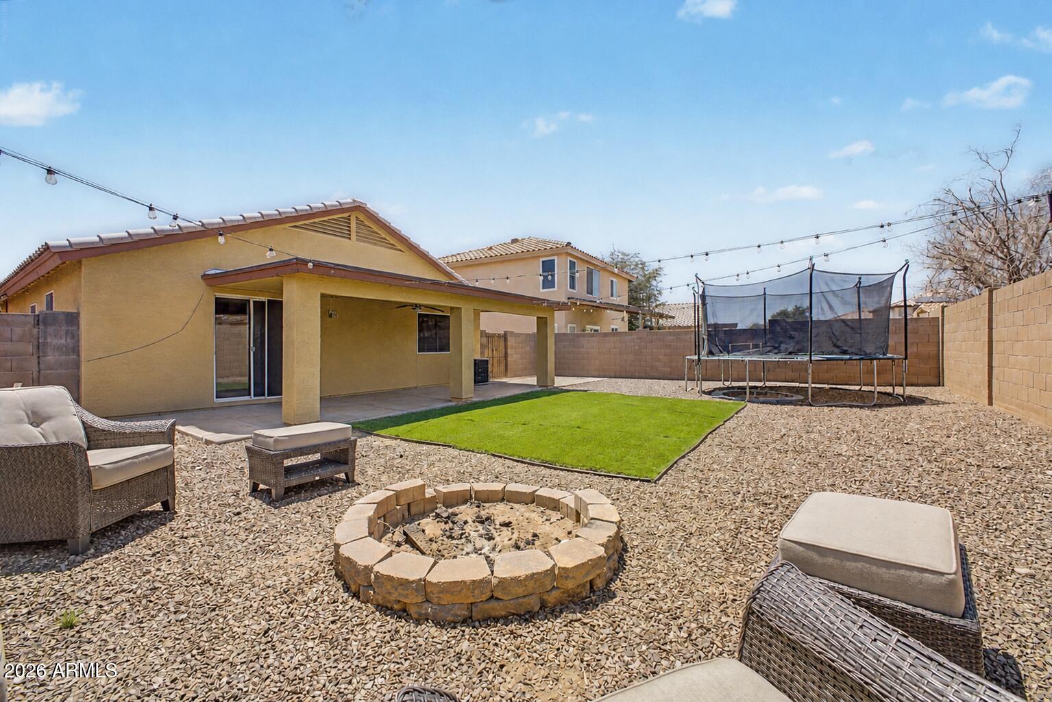 12008 West Larkspur Road El Mirage, AZ 85335 - Photo 23 of 25 a front view of a house with garden