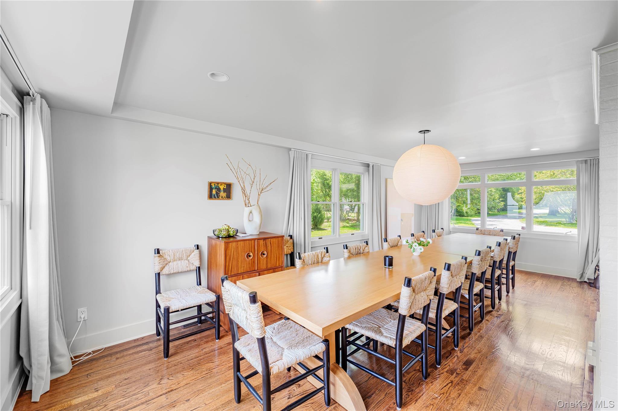5 Thorn Hedge Road Bellport, NY 11713 - Photo 12 of 42 a view of a dining room with furniture and wooden floor