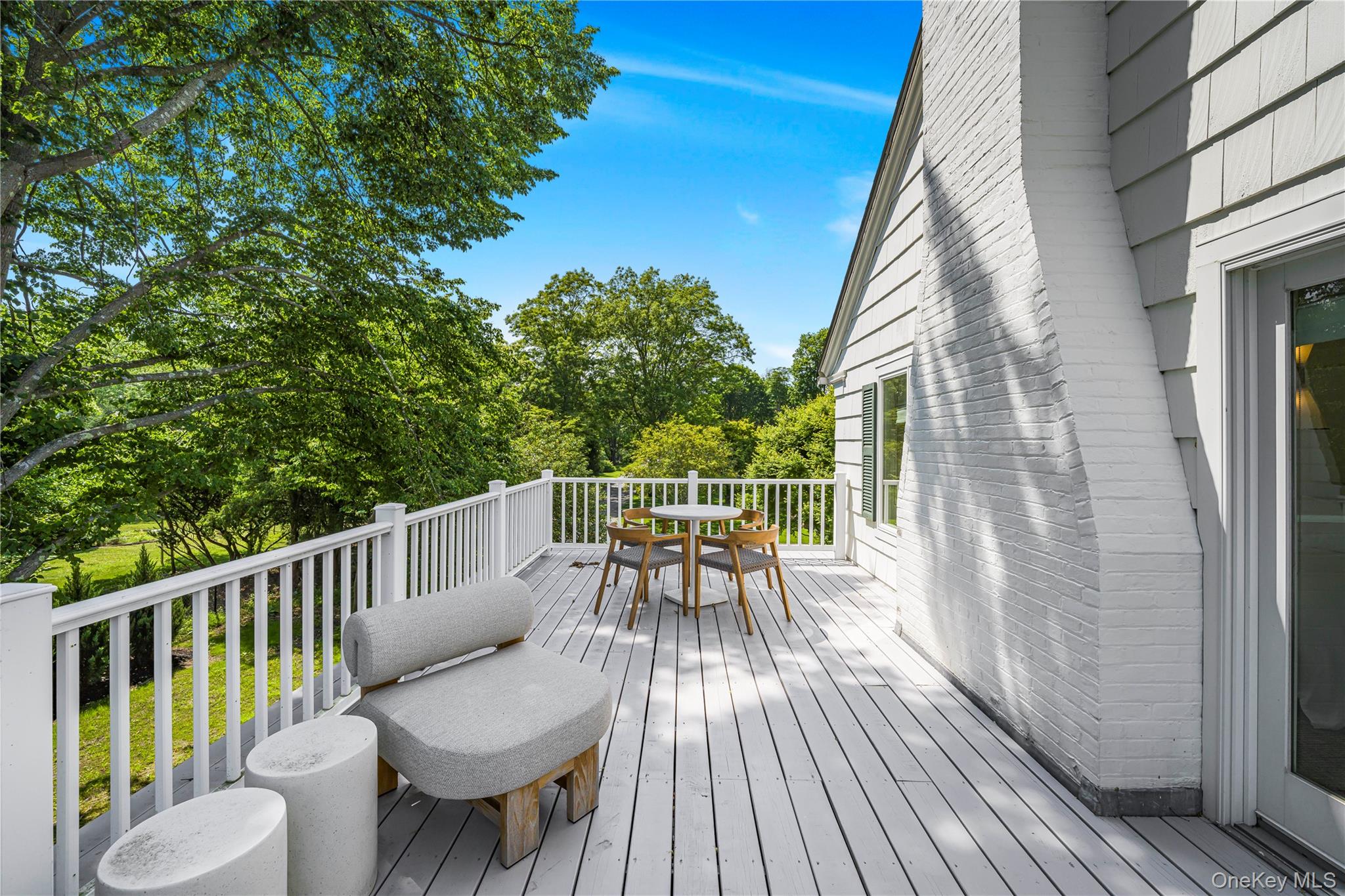 5 Thorn Hedge Road Bellport, NY 11713 - Photo 23 of 42 a view of balcony with furniture and wooden deck
